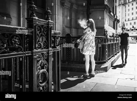 Uk Lifestyle Woman Person Smoking A Cigarette Outside An Office