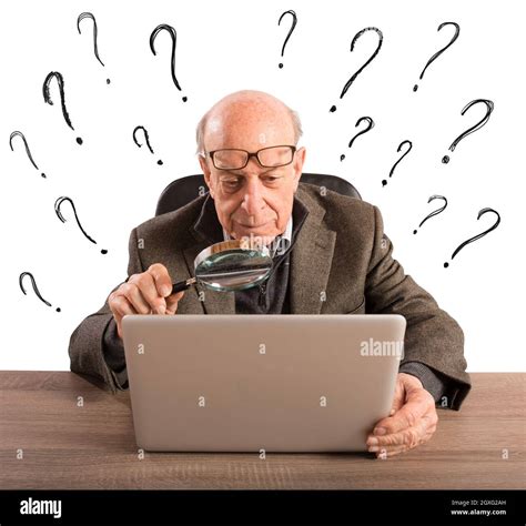 Confused Elderly Man Looks At The Computer Stock Photo Alamy