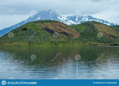 Beautiful Patagonian Waterfall In A Forest Lit By The Rising Sun Of