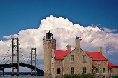 Mackinac Bridge And The Mackinaw City Lighthouse At The Straits Of