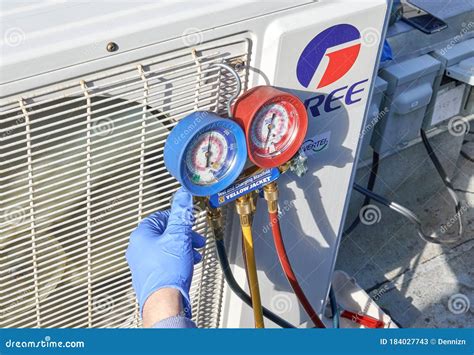 Engineer Checking Ac Refrigerant Level And Refilling Freon Editorial