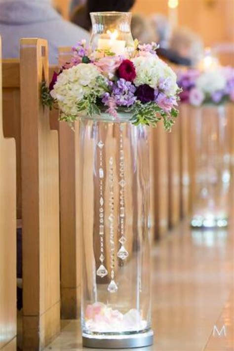 Maybe you would like to learn more about one of these? Church flowers | Wedding centerpieces, Ceremony ...