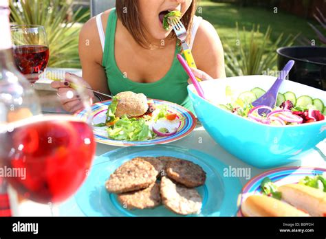 Young Woman Sausage With Salad Model Released Stock Photo Alamy