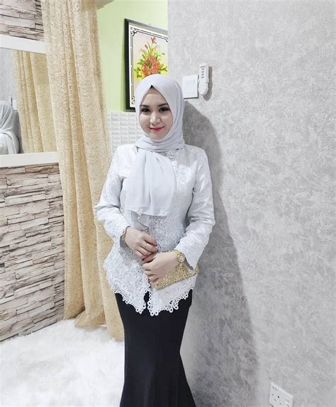 image may contain 1 person standing nyssa muslim beauty hijab chic kebaya malaysian happy