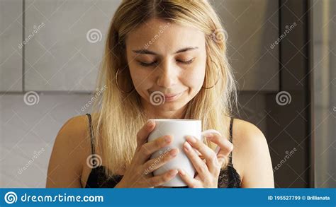 Close Up Of A Woman Taking In Smell Of Coffee With Her Eyes Closed Stock Image Image Of