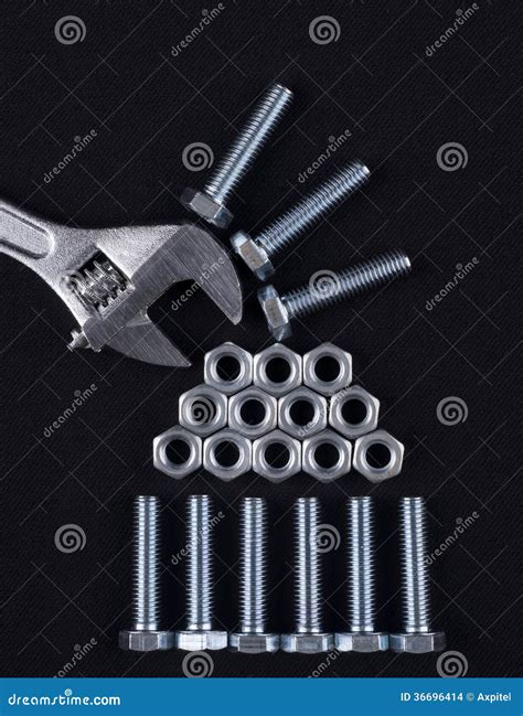 Adjustable Wrench With Screws And Nuts Stock Photo Image Of