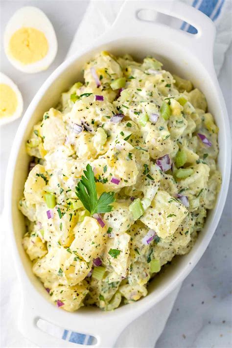 Now we have perfectly cooked and seasoned potatoes and a creamy dressing, it's time to add some extra ingredients. Easy All-American Potato Salad Recipe - Jessica Gavin