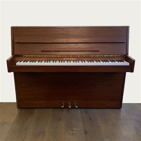 A Rippen Mahogany Satin Upright Piano