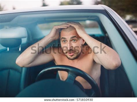 Naked Man In The Car Is In A Traffic Jam