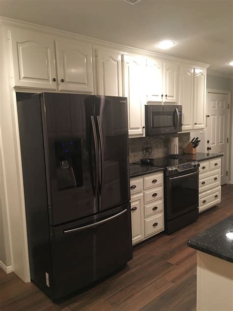 Commercial kitchen cabinets are a valuable addition to any commercial kitchen. Black stainless steel appliances. Steel gray counter tops ...