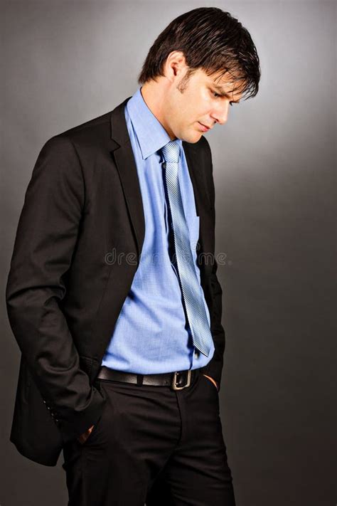 Portrait Of A Thoughtful Young Business Man Looking Down Stock Image