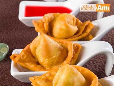 Wet the edges using your finger dipped in water then fold the wontons in half to form triangles. Chicken Wontons | Recipe