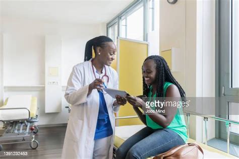 minority patient with doctor photos and premium high res pictures getty images