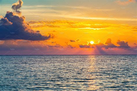 Bright Sunset Over Ocean High Quality Nature Stock Photos ~ Creative