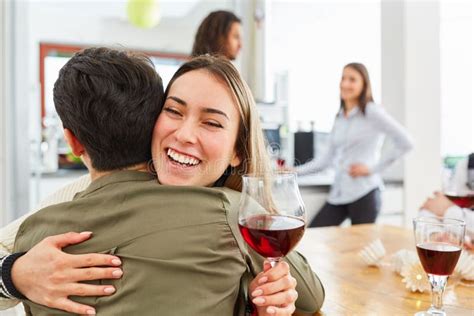 Two Friends Hug Each Other At A Party In The Kitchen Stock Image