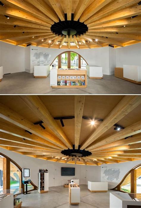 The Inside And Outside Of A Building With Wooden Beams On The Ceiling