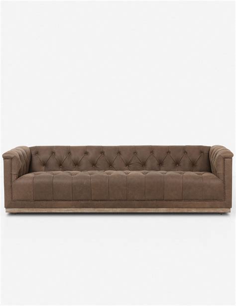 A Tufted Style With Bronzed Nail Heads Give This Sofa A Traditional