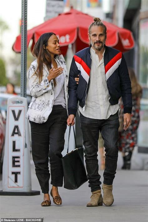 zoe saldana and her husband marco perego still look like newlyweds as they stroll arm in arm in