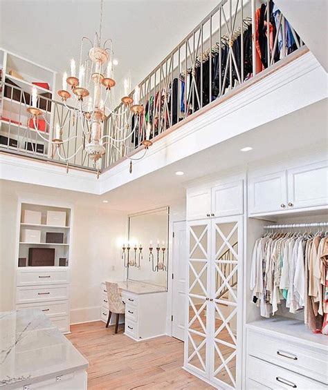 Never let another piece of clothing fall to the floor of your closet. 2 story closet? Yes, please. This is insanity, and so ...