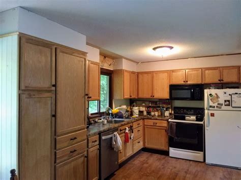 The crown molding detail on the cabinets and the extensive crown at the ceiling give the cabinets more of a finished feel. How to Build your Cabinets to the Ceiling | - Lifestyle, Beauty, Technology etc. Knowledge ...