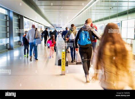 Airport People Rushing For Their Flights Long Corridor With Moving