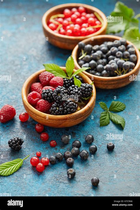 Various Summer Fruits In A Wooden Bowls Assorted Fresh Berries With