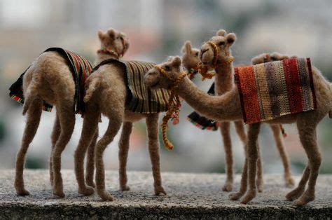 Winds blow sand all around, so a camel has long eyelashes. beautiful! needle felted nativity camels-we have felting ...