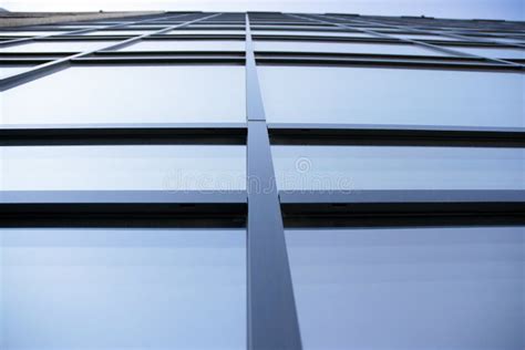 Abstract Texture And Blue Glass Facade In Modern Office Building Stock