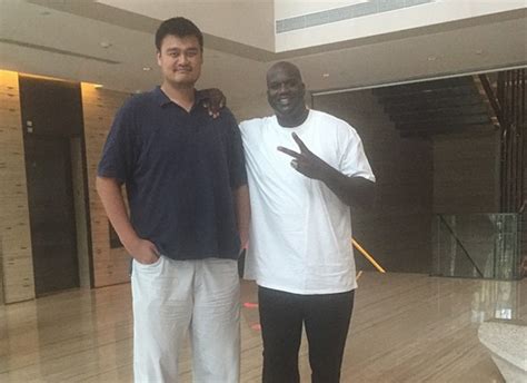 yao ming makes everyone look tiny including shaq for the win