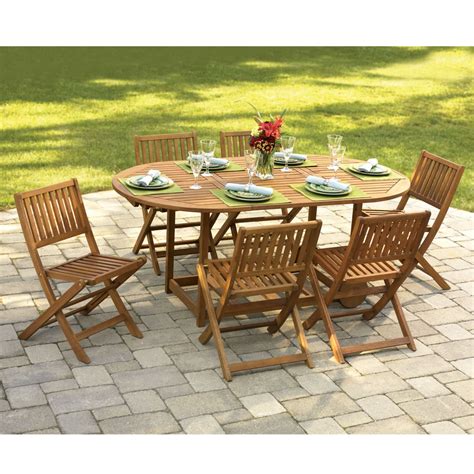 The Gateleg Patio Table And Stowable Chairs Hammacher