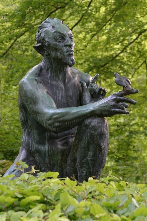 A Statue Of Pan Greek God Of Nature Whistling To A Small Bird Forest Of Marselisborg Denmark