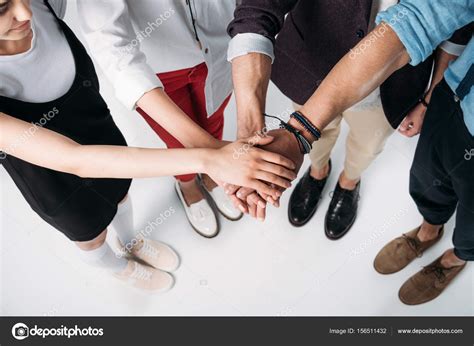 Friends Putting Hands Together Stock Photo By ©alexlipa 156511432