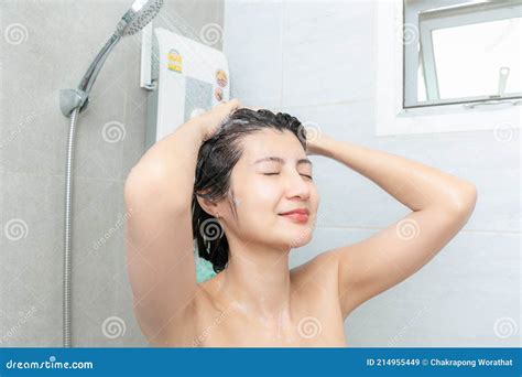 Beautiful Asian Young Woman Taking Shower In Bathroom Stock Image