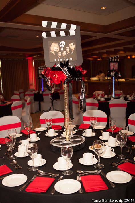 This theme makes the perfect idea for a prom. Movie theme bar bat mitzvah - tall centerpiece - red and ...