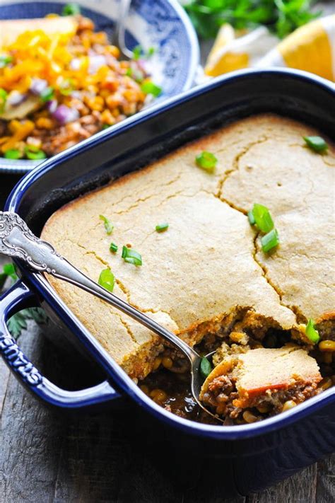 Add the beef, soft butter, seasonings, and egg to the onions in the mixing bowl and beat vigorously with a wooden spoon to blend thoroughly. Ground Beef Casserole with Cornbread Crust | RecipeLion.com