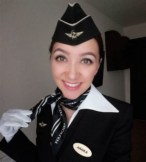 画像に含まれている可能性があるもの 1人 sexy stewardess flight attendant uniform cabin crew