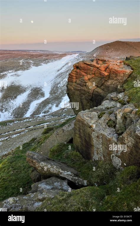 Gritstone Rocks On Mount Famine View Towards Snowy Moorland Near