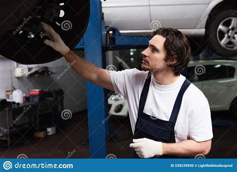 Side View Of Workman Checking Car Stock Photo Image Of Repairman