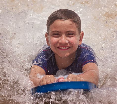 Happy Boy Surfing On Sea Wave · Free Stock Photo