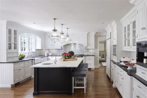 As far as pictures of kitchen cabinets are concerned, there is no dearth of such collections in the web. White Kitchen with Black Beadboard Island