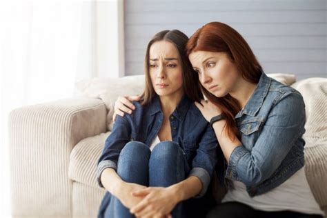 Woman Comforting Unhappy Friend Stock Photo By ©saragolfart