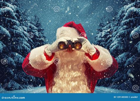 Santa Claus Looking Through Binoculars Christmas Concept Stock Photo