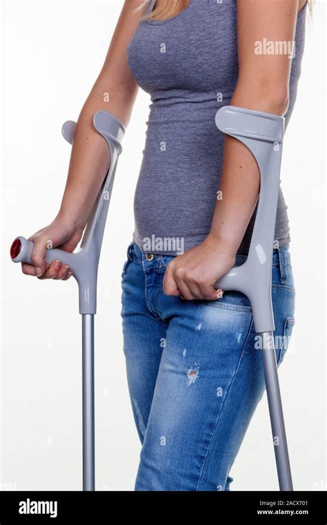 Woman Crutches Hi Res Stock Photography And Images Alamy