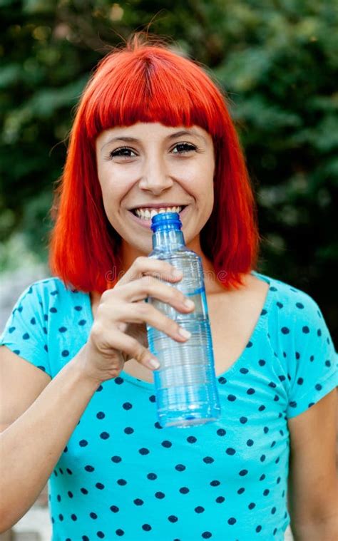 Redhead Girl Drinking Water In A Park Stock Image Image Of Health