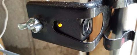 An easy way to tell if your garage door sensors are out of alignment is by checking if the exterior led light blinks when you attempt to close the door. Why Is One Of My Garage Door Sensors Yellow - The Door