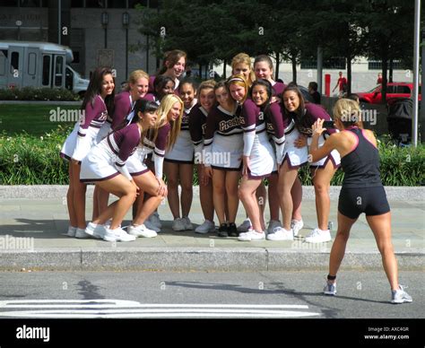 Coach Taking A Picture Of A Group Of Cheerleader Usa Manhattan New