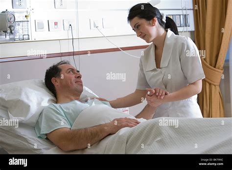 Nurse Caring For Patient Stock Photo Alamy