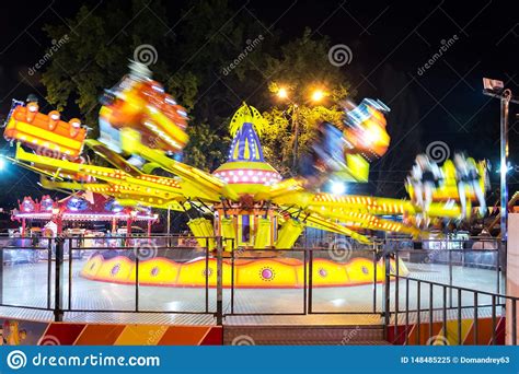 Carousel Amusement At Night In The Park With A Blurred Motion Long