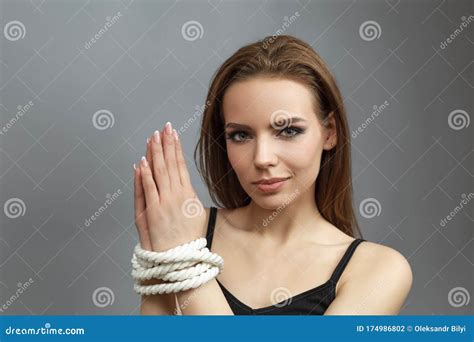 Excited Pretty Woman With Tied Hands With A Rope Stock Photo Image Of