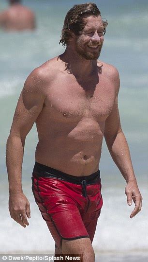 In The Swim Of It Shirtless Simon Baker Puts His SCAR On Show As He
